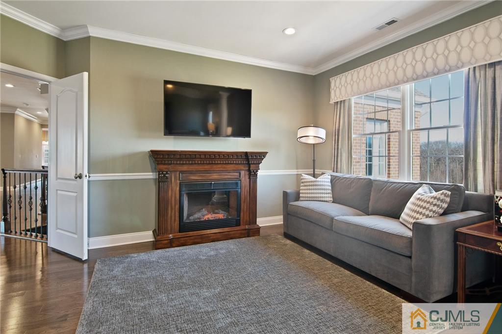 25 Preakness Drive Monroe Township, NJ 08831 - Photo 22 of 48 a living room with furniture and a fireplace