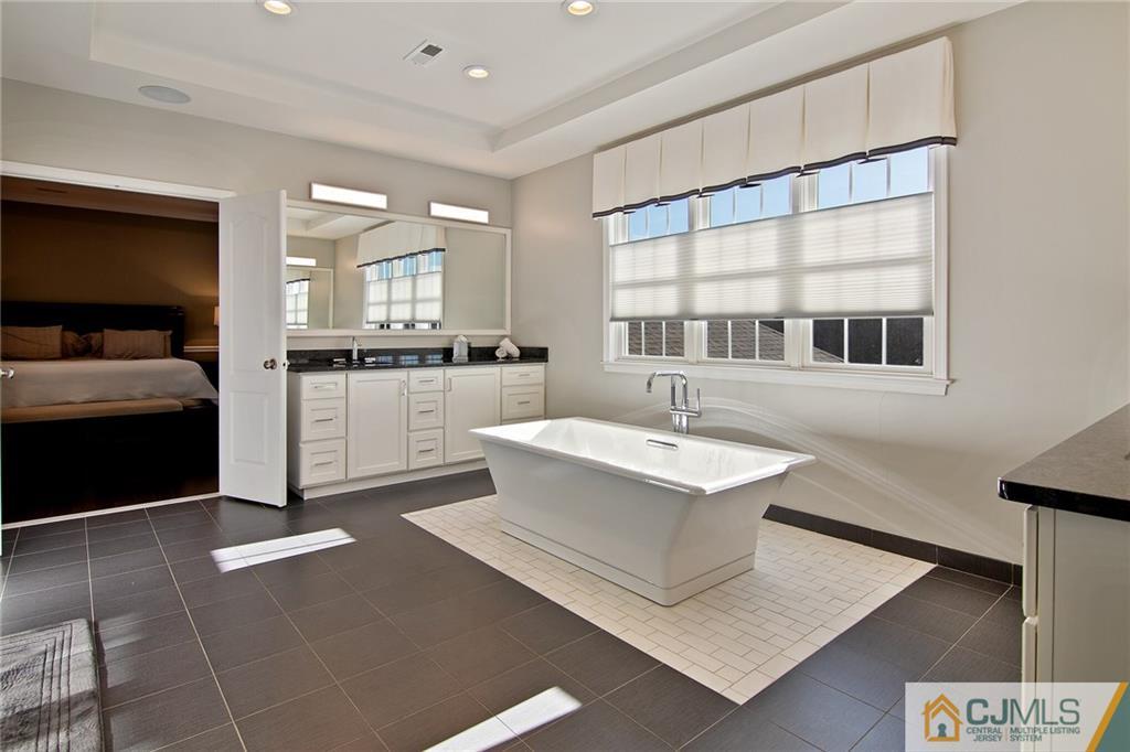 25 Preakness Drive Monroe Township, NJ 08831 - Photo 27 of 48 a large white kitchen with a large window