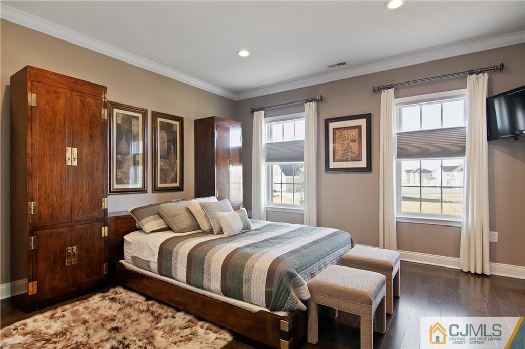 25 Preakness Drive Monroe Township, NJ 08831 - Photo 34 of 48 a bedroom with a bed and wooden floor