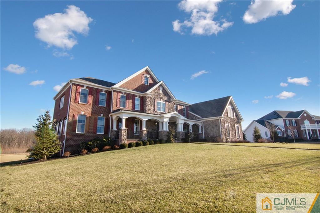25 Preakness Drive Monroe Township, NJ 08831 - Photo 45 of 48 a front view of a house with large trees