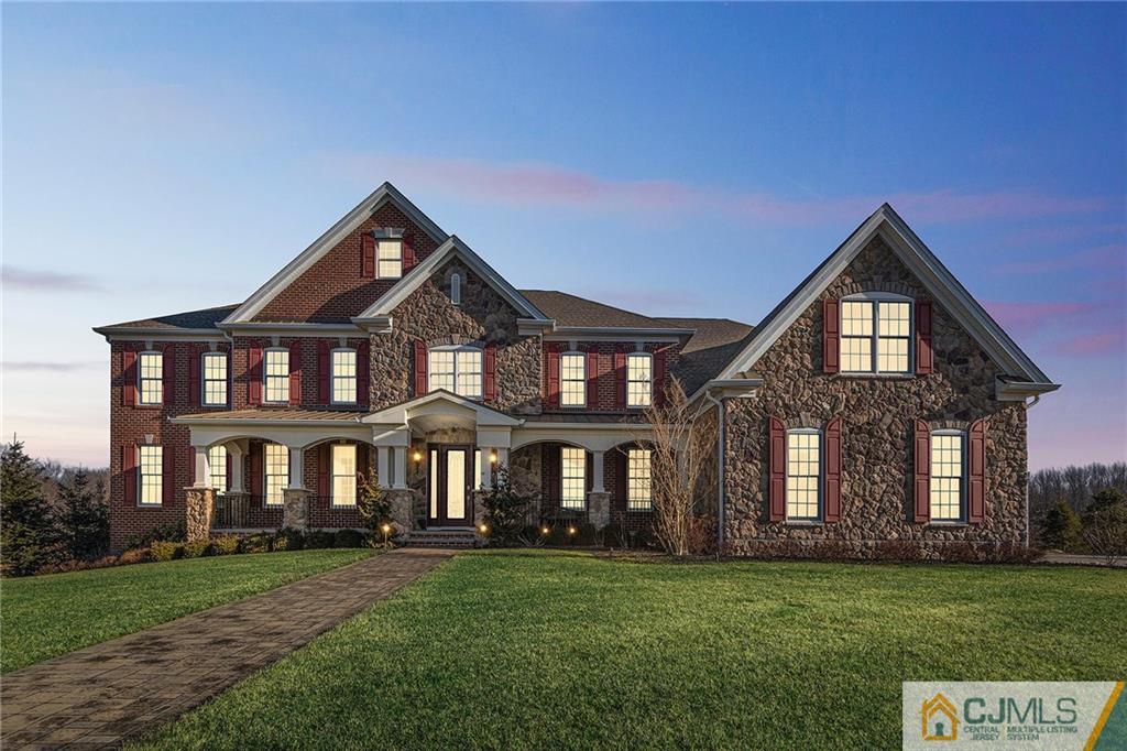 25 Preakness Drive Monroe Township, NJ 08831 - Photo 47 of 48 a front view of a house with a garden