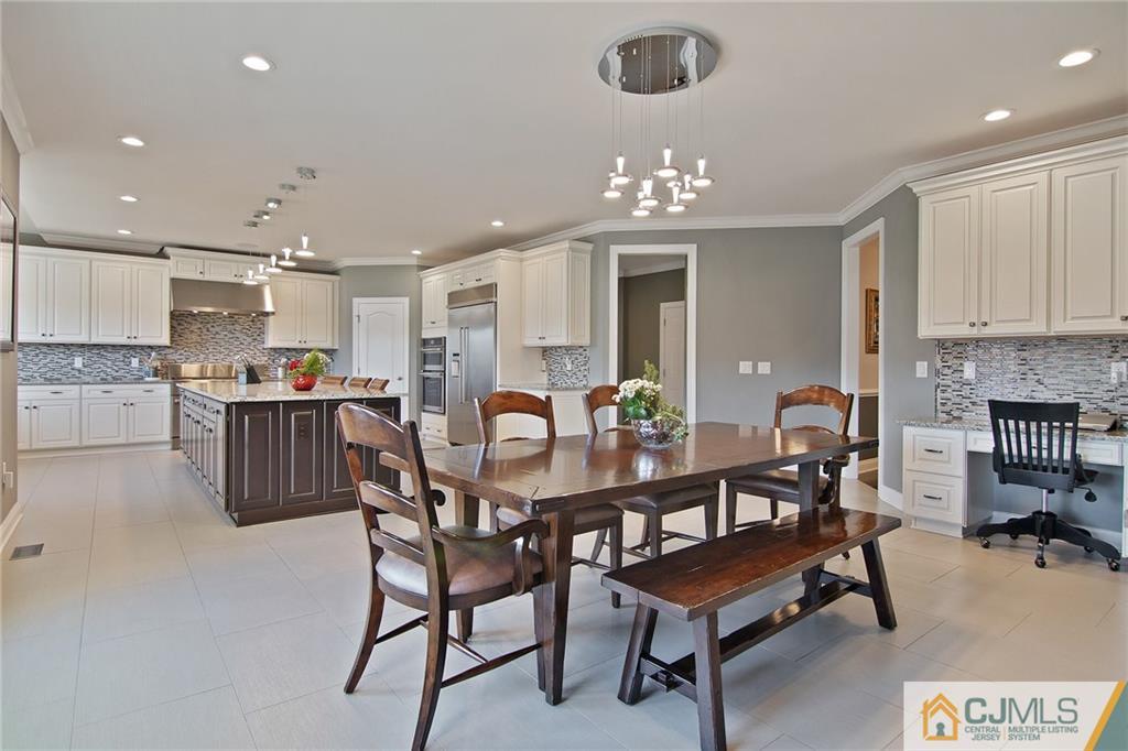 25 Preakness Drive Monroe Township, NJ 08831 - Photo 9 of 48 a view of a dining room with furniture and chandelier