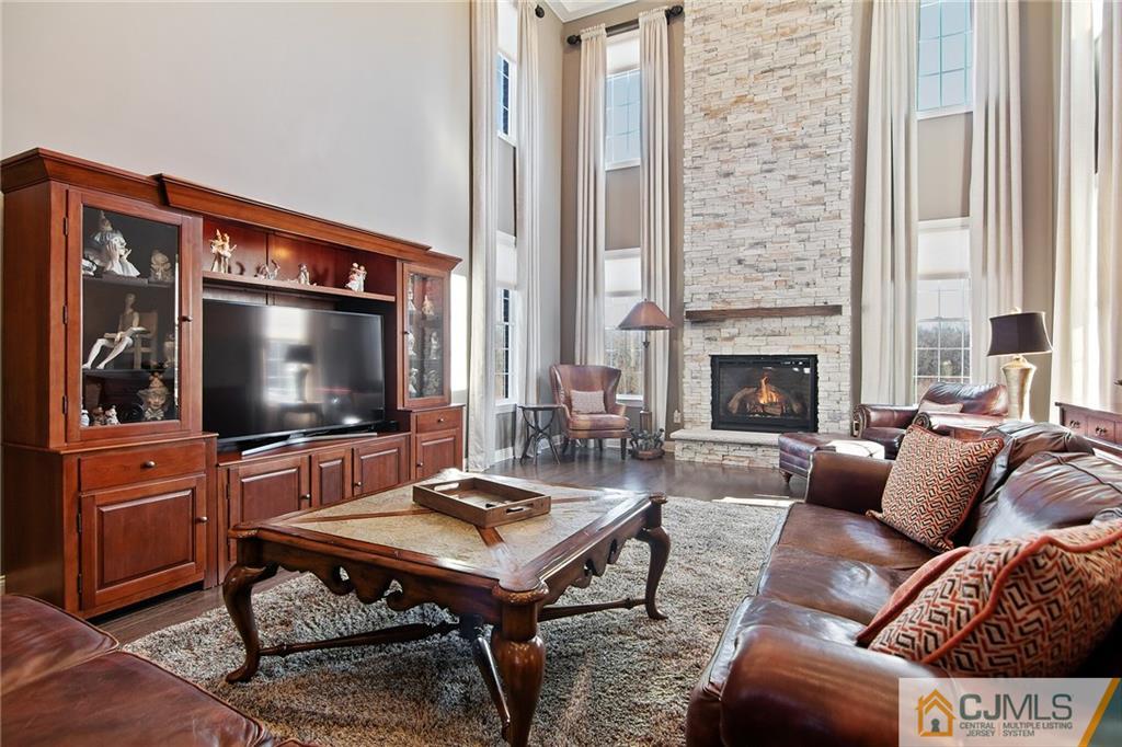 25 Preakness Drive Monroe Township, NJ 08831 - Photo 10 of 48 a living room with furniture and a flat screen tv