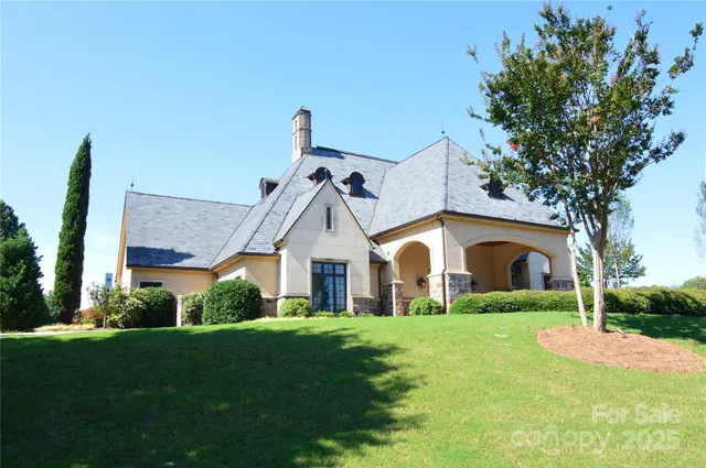 a front view of house with yard and green space