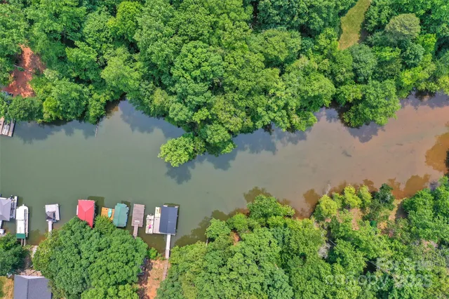 an aerial view of a house with a yard and a garden