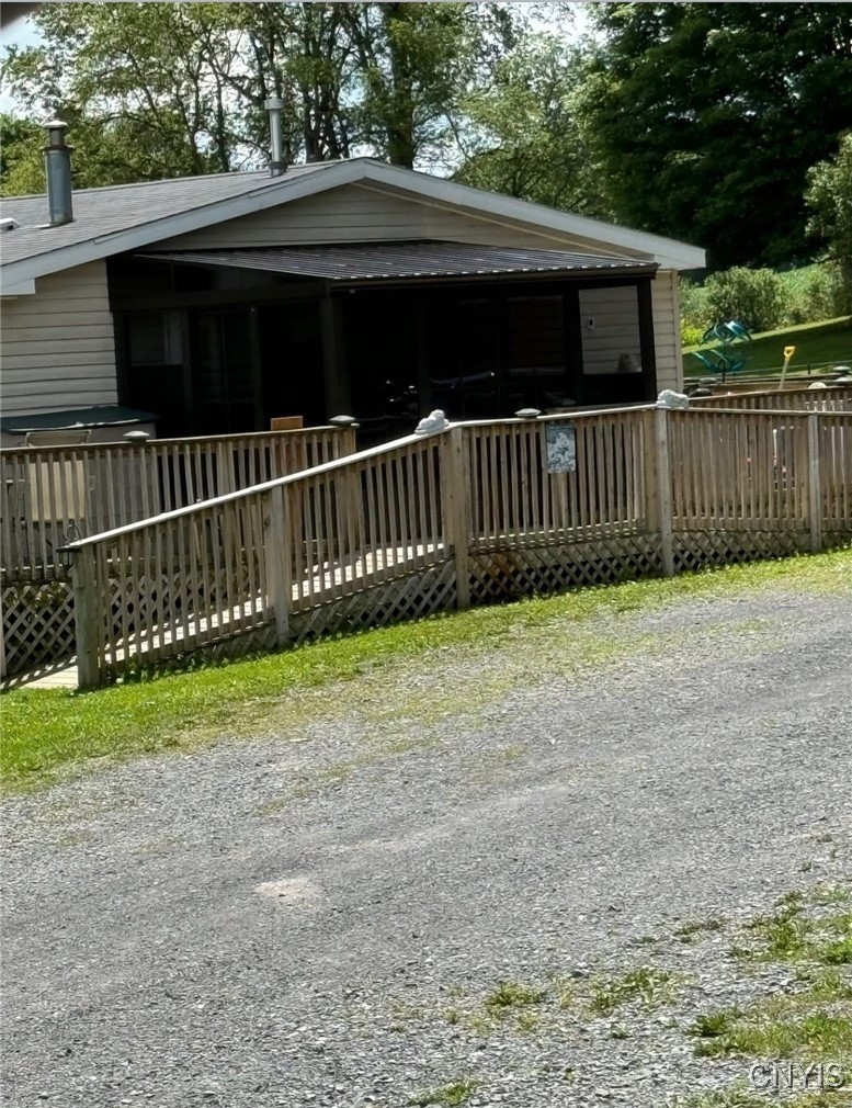 39 Stauber Road Groton, NY 13073 - Photo 7 of 50 view of sunroom in the summer