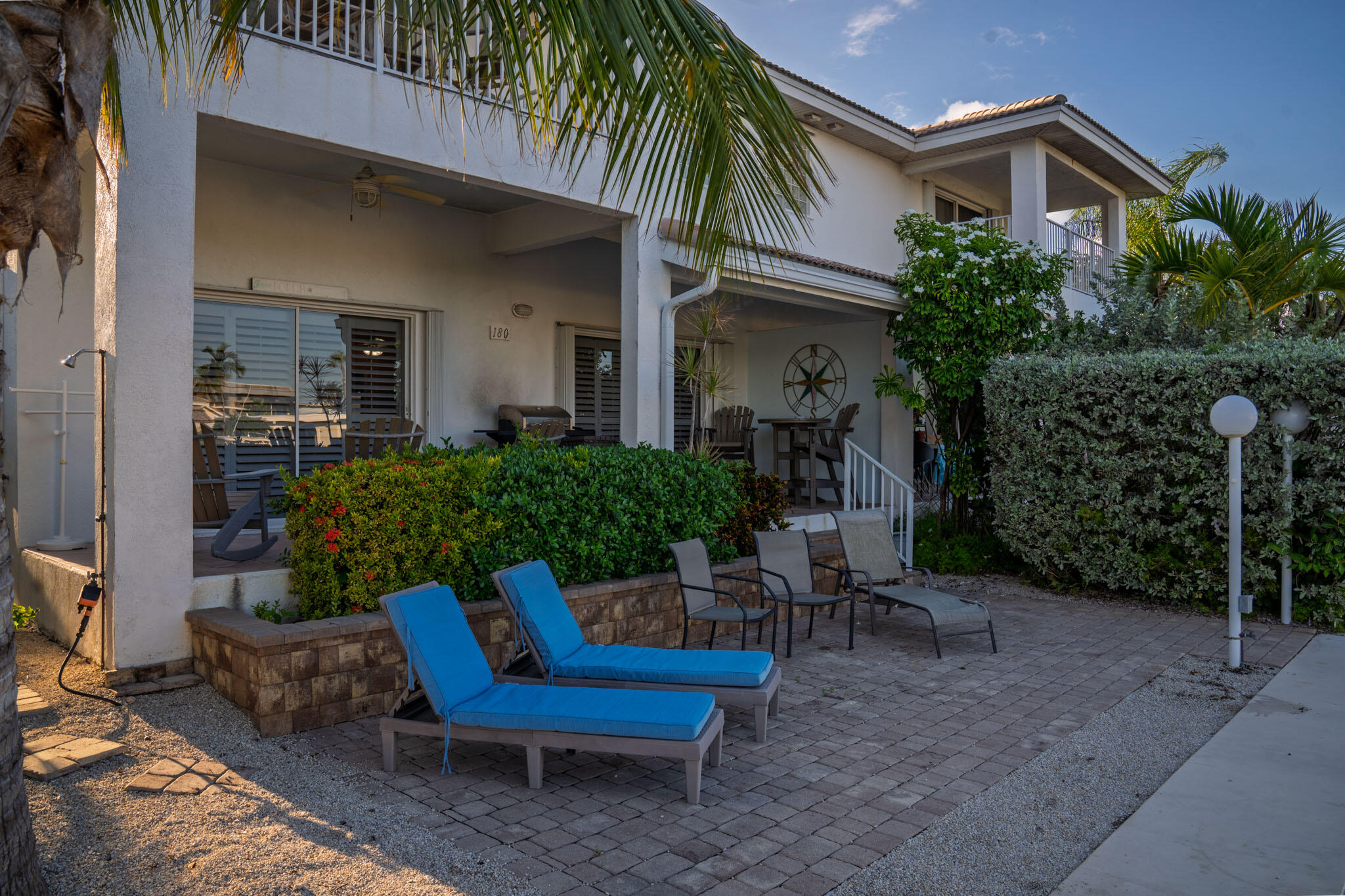 180 9th Street Key Colony Beach, FL 33051 - Photo 27 of 38 a view of a chair and table in backyard of the house