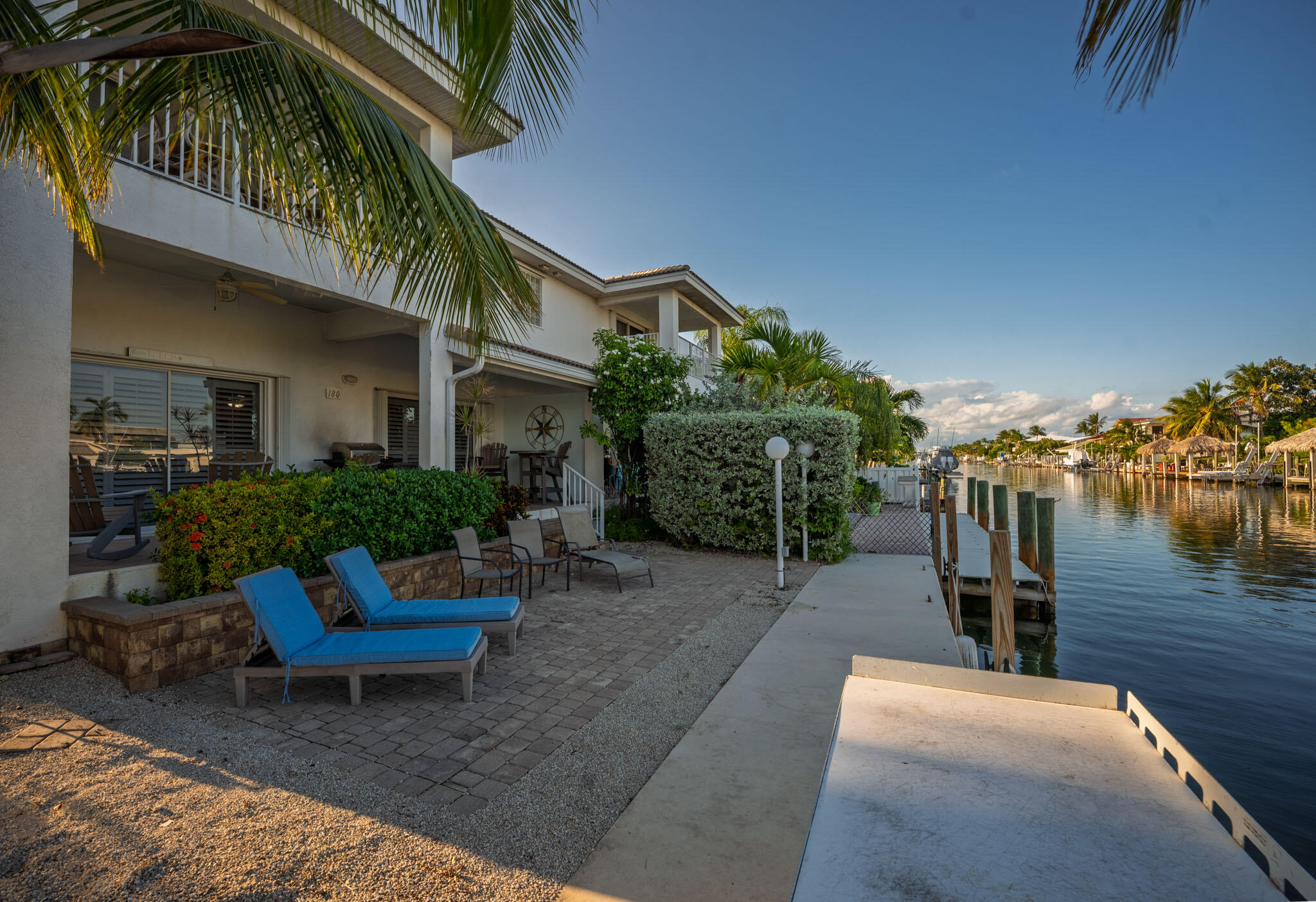 180 9th Street Key Colony Beach, FL 33051 - Photo 3 of 38 a view of a house with backyard and sitting area