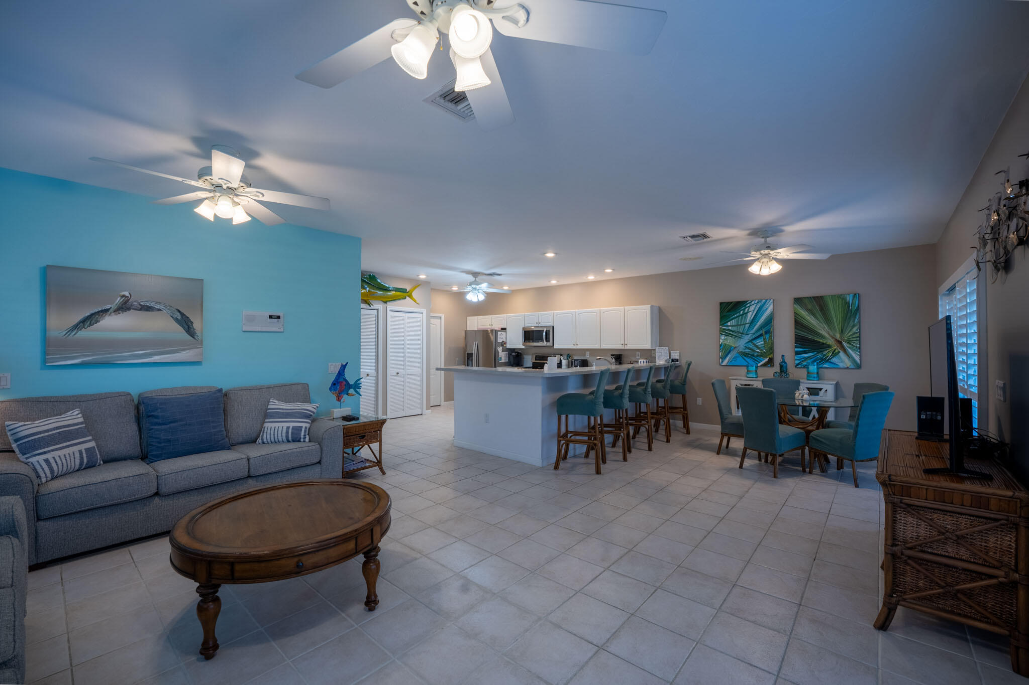 180 9th Street Key Colony Beach, FL 33051 - Photo 6 of 38 a living room with furniture and a chandelier