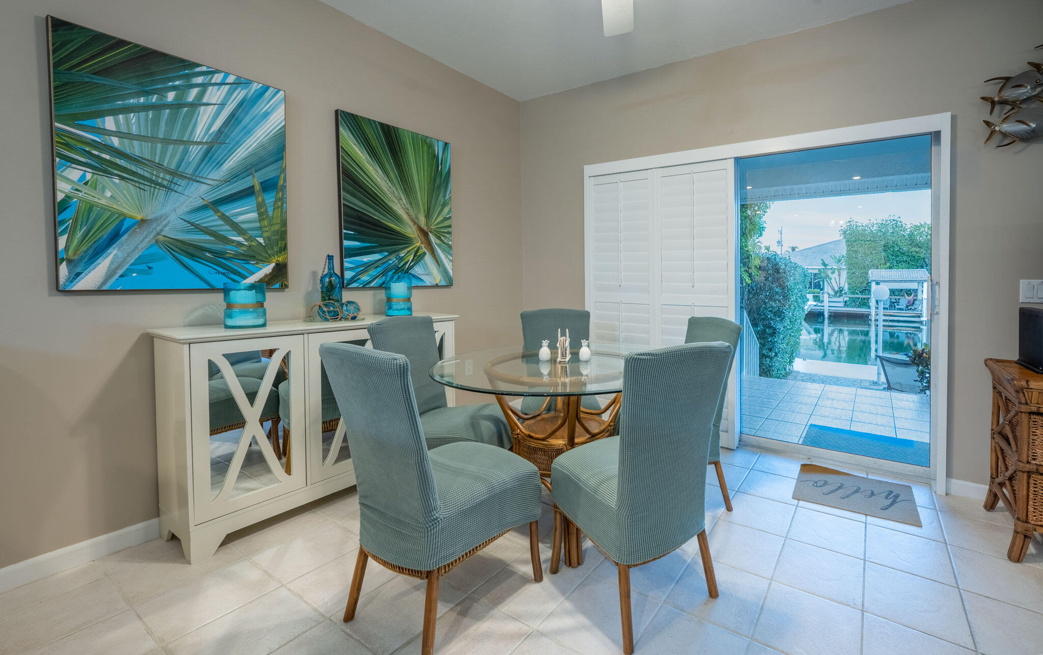 180 9th Street Key Colony Beach, FL 33051 - Photo 9 of 38 a view of a dining room with furniture a chandelier and window