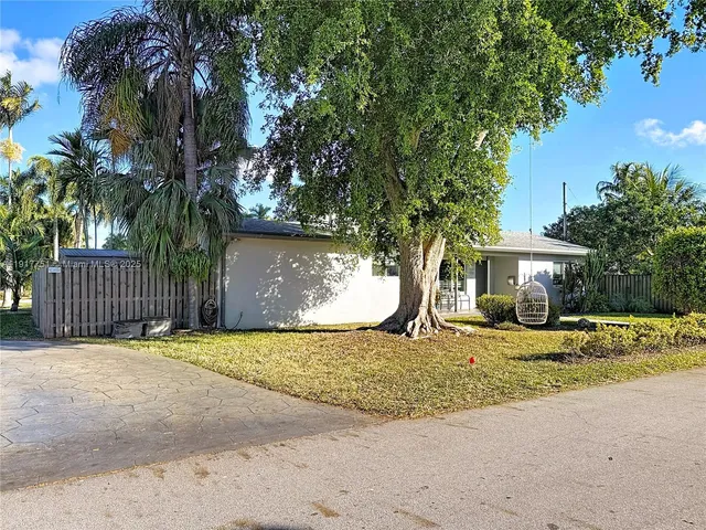 a front view of a house with yard