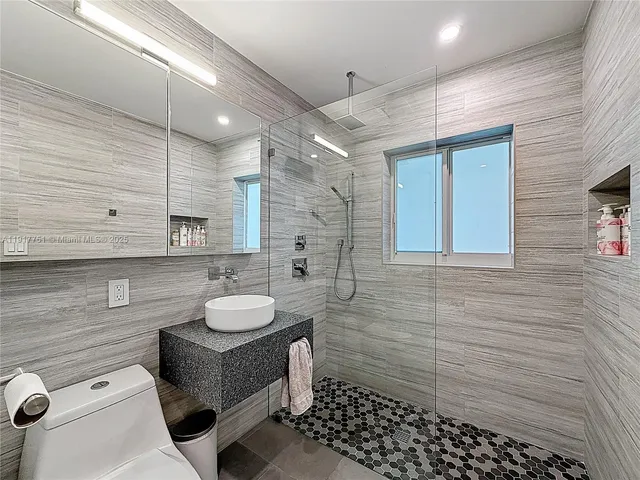 a view of a chairs and table in the patio