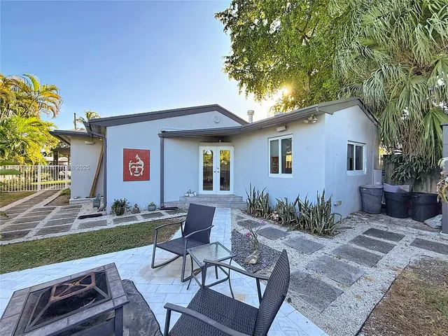 a view of a swimming pool with a patio
