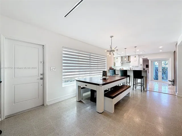 a living room with furniture fireplace and a window