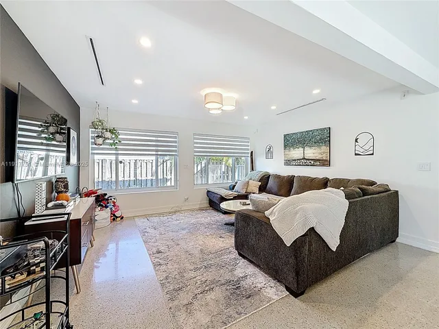 a kitchen with stainless steel appliances a stove a sink and a microwave