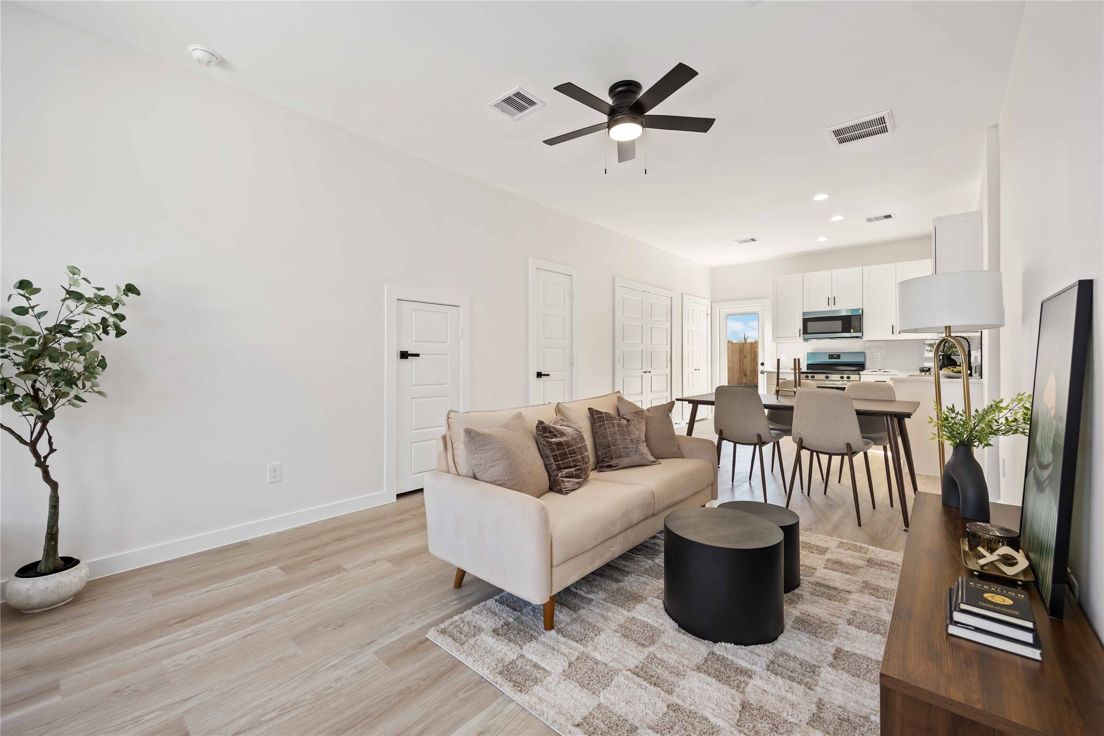5523 Haight Street, Unit B Houston, TX 77028 - Photo 5 of 17 a living room with furniture and wooden floor