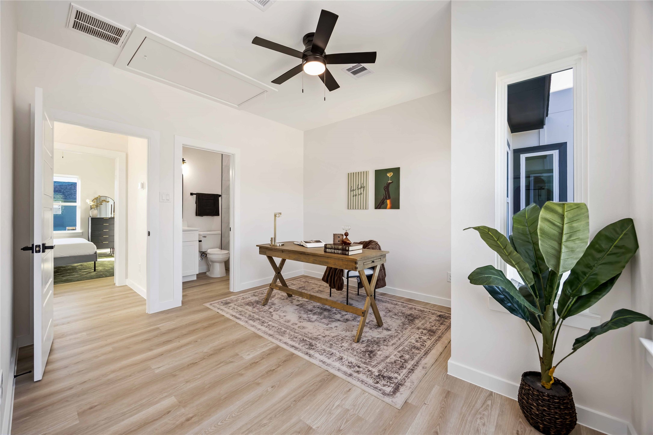 5523 Haight Street, Unit B Houston, TX 77028 - Photo 9 of 17 a living room with furniture a dining table and a potted plant