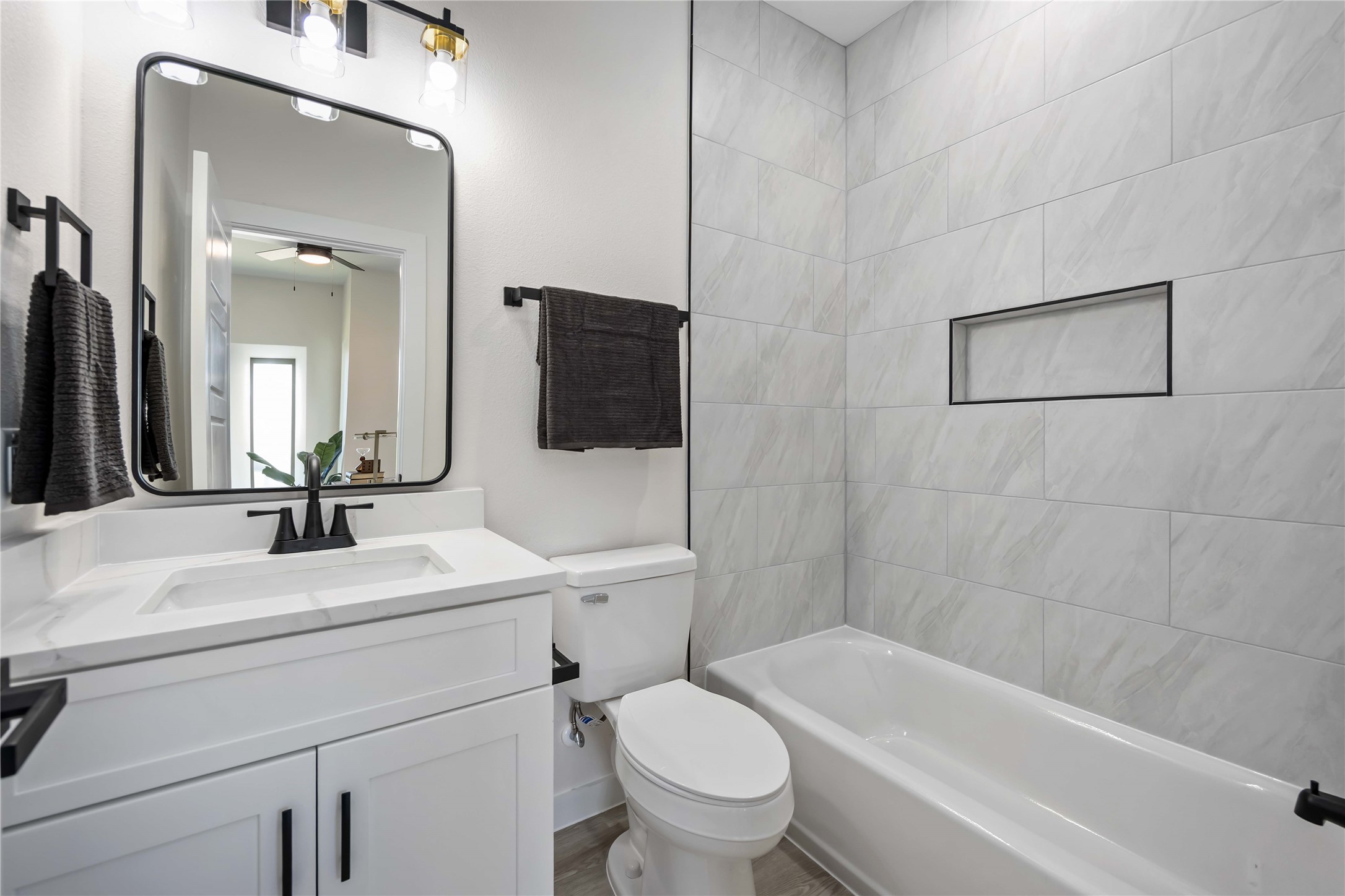 5523 Haight Street, Unit B Houston, TX 77028 - Photo 10 of 17 a bathroom with a sink a toilet and shower