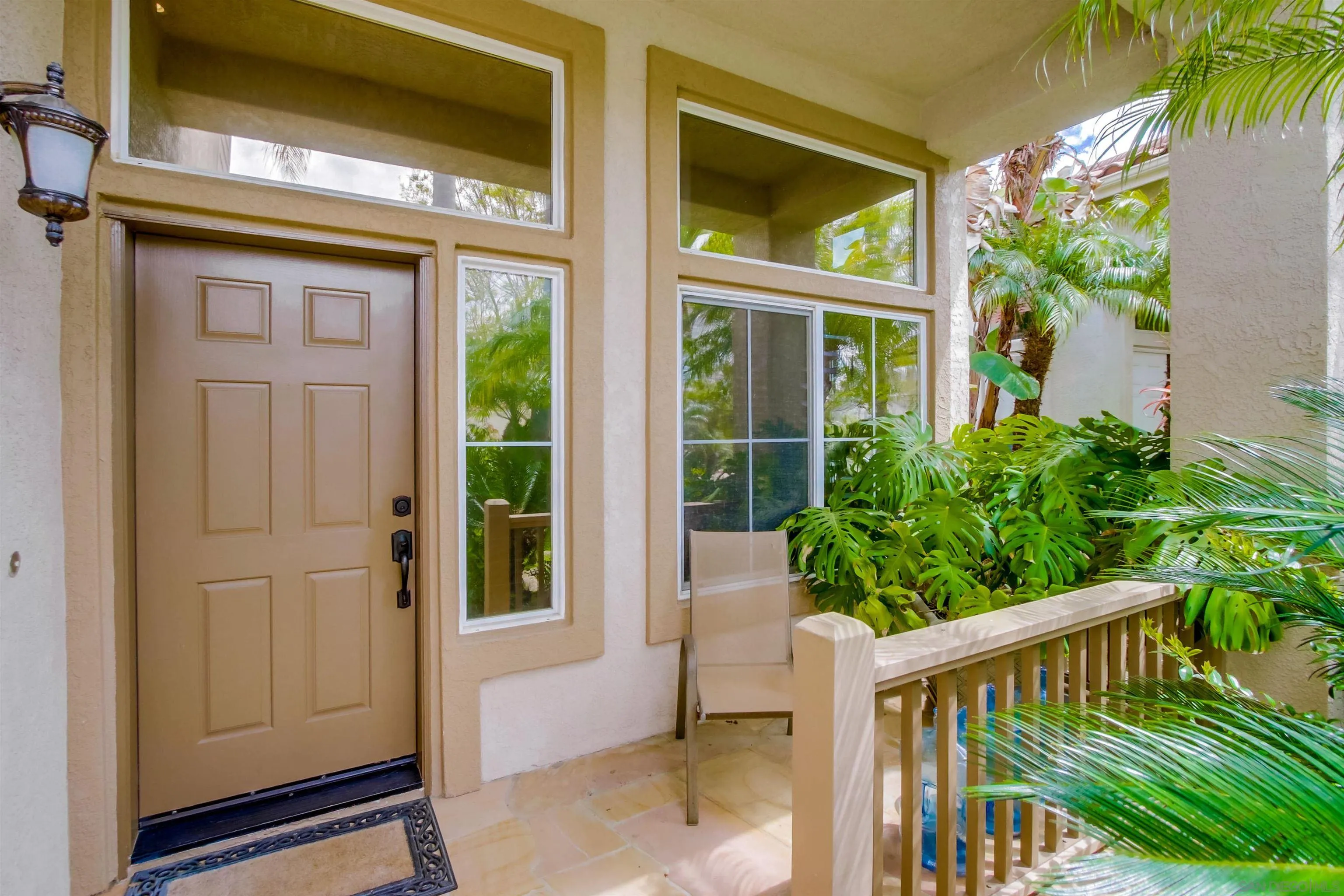 6550 Windward Ridge Way San Diego, CA 92121 - Photo 17 of 64 a view of a brick house with a large window