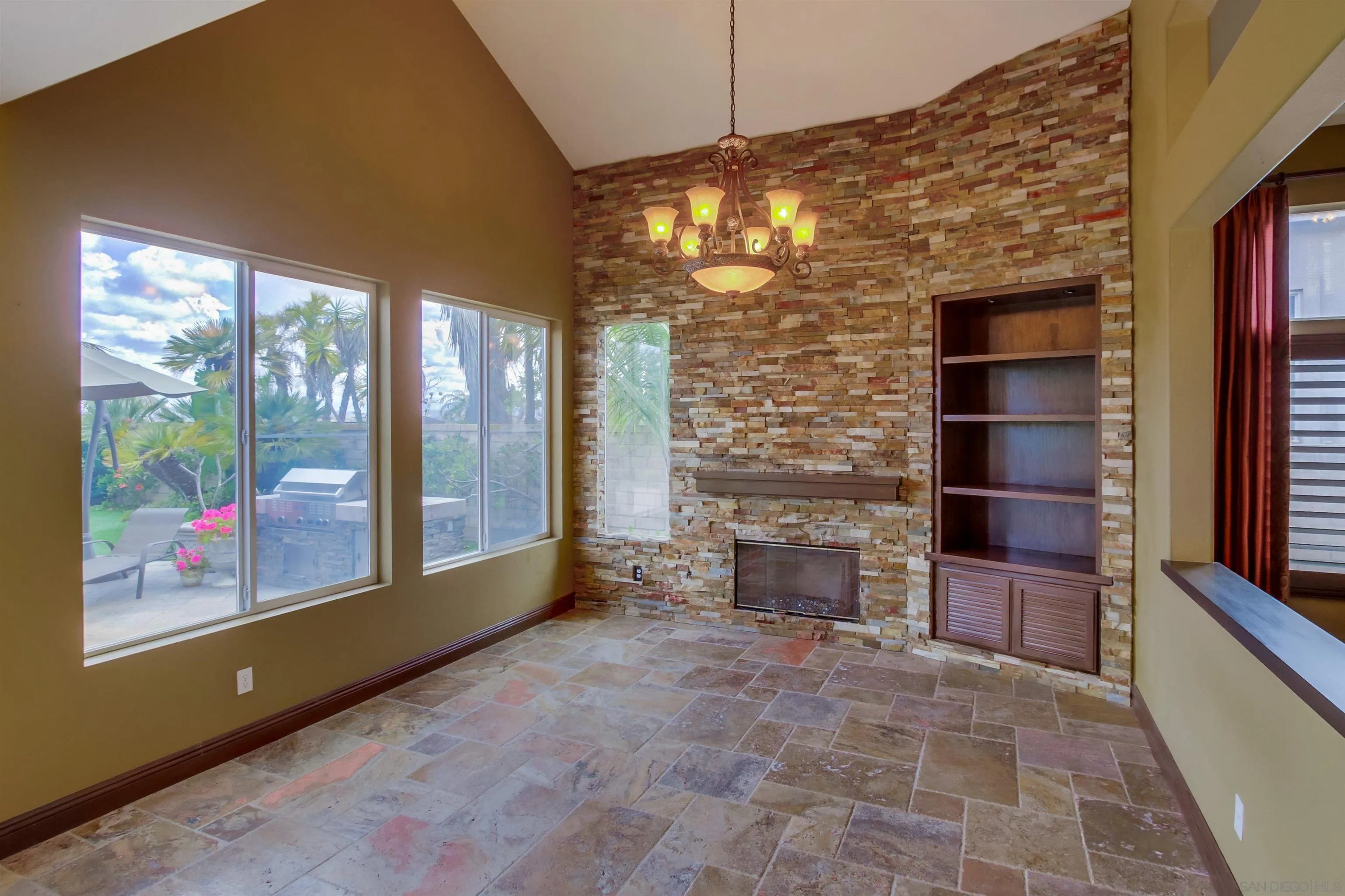 6550 Windward Ridge Way San Diego, CA 92121 - Photo 21 of 64 a view of an empty room with a fireplace and a window