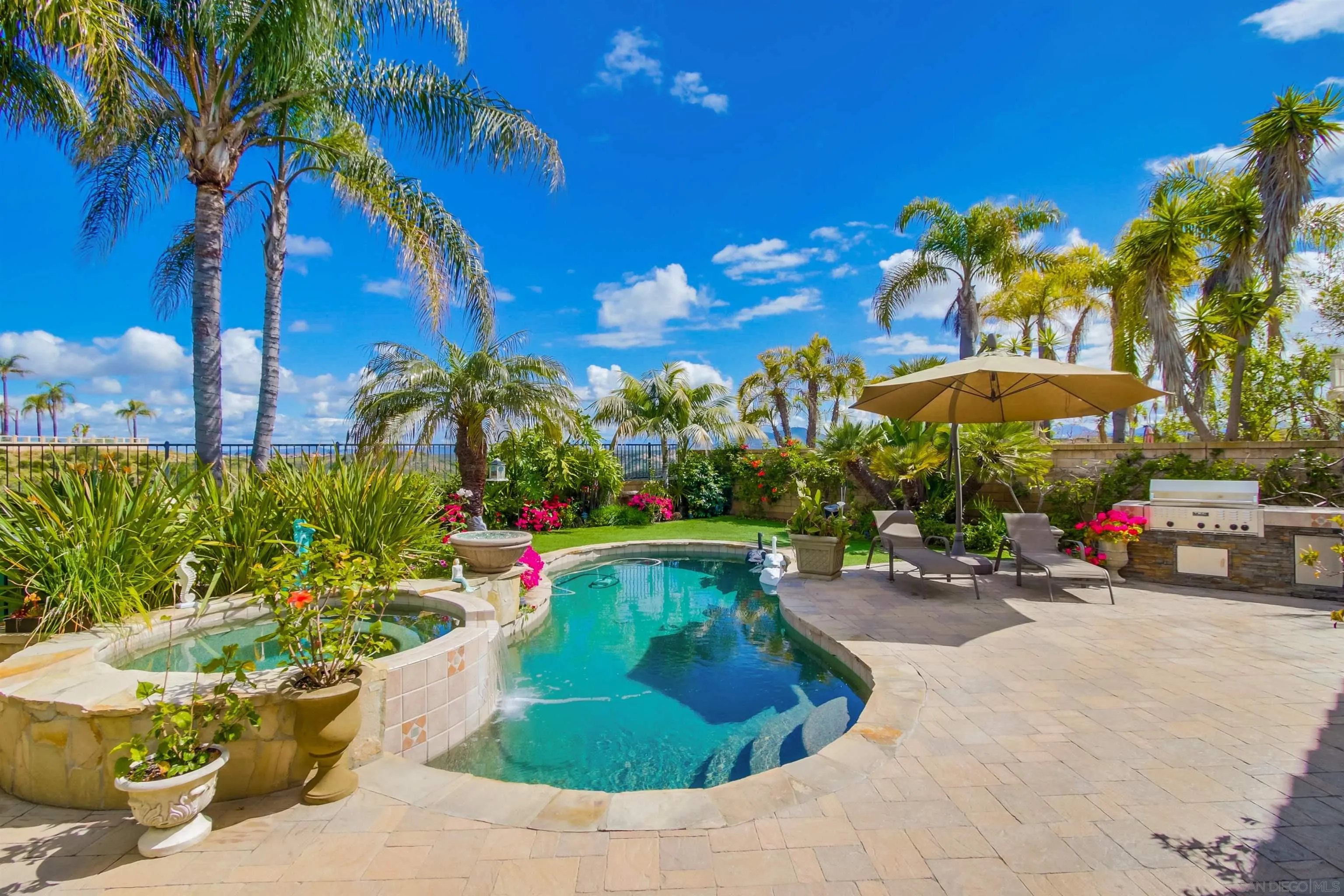 6550 Windward Ridge Way San Diego, CA 92121 - Photo 42 of 64 a view of a backyard with swimming pool and furniture