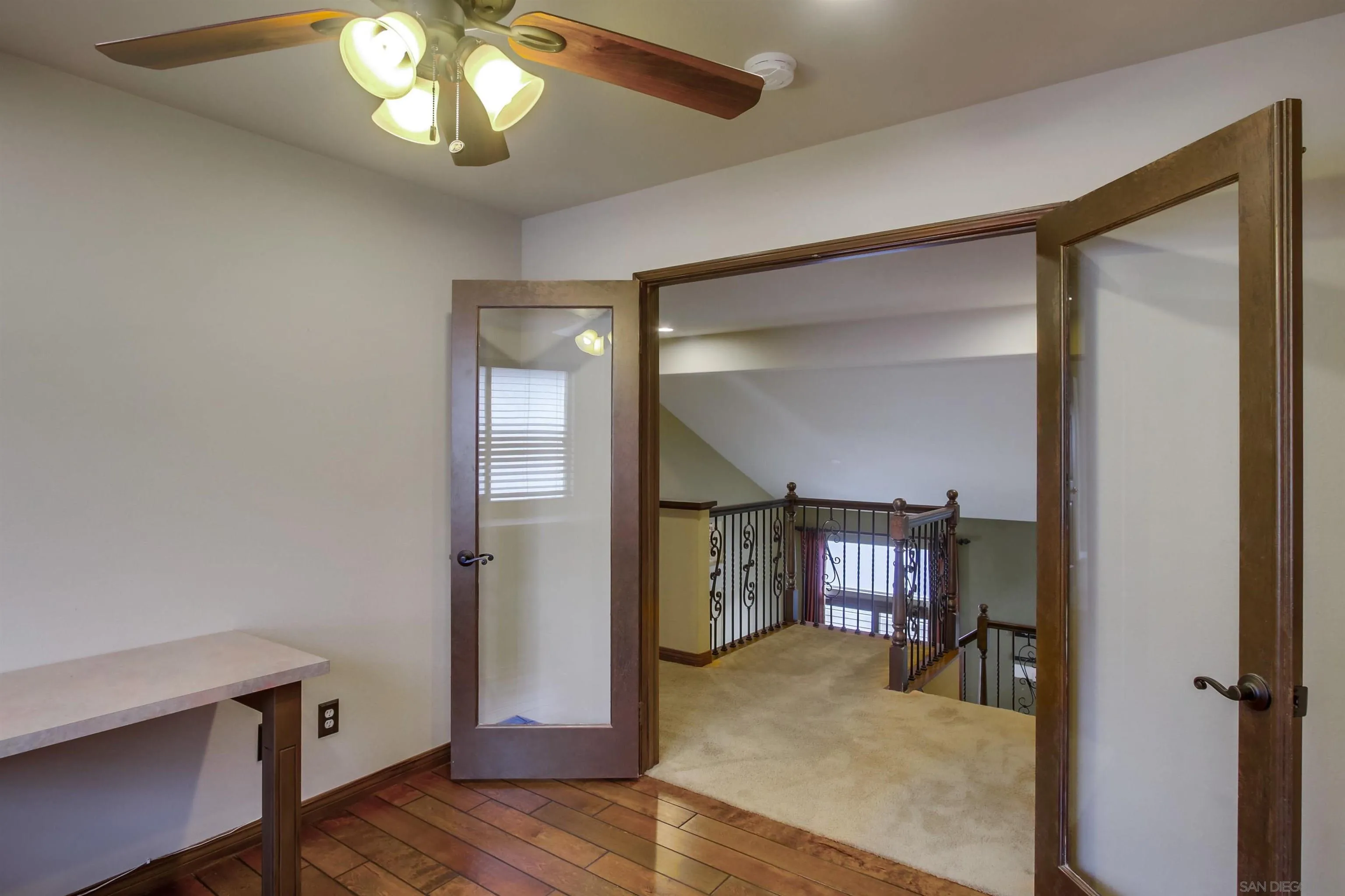 6550 Windward Ridge Way San Diego, CA 92121 - Photo 50 of 64 a view of a livingroom with a wooden furniture