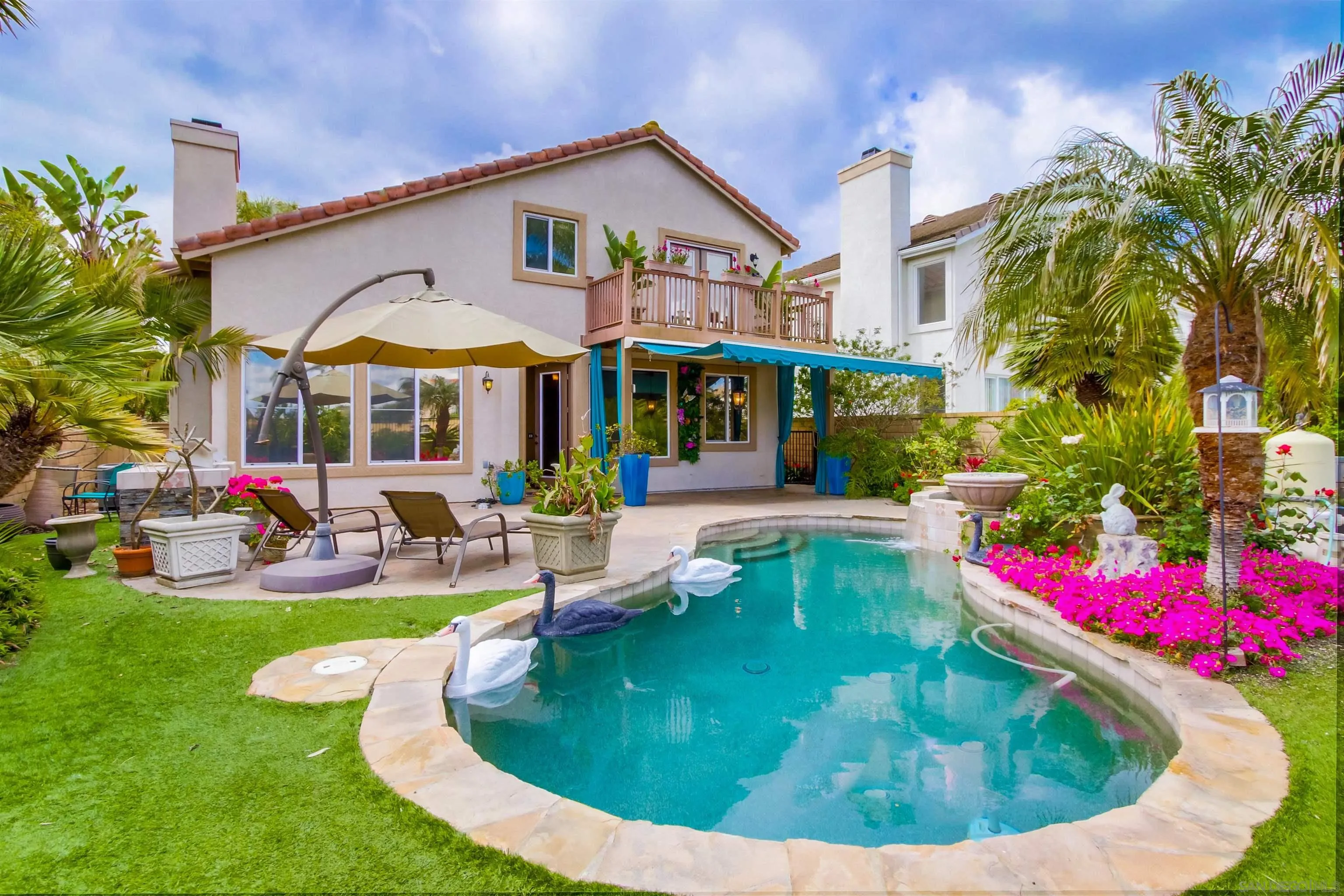 6550 Windward Ridge Way San Diego, CA 92121 - Photo 57 of 64 a view of a house with swimming pool and sitting area