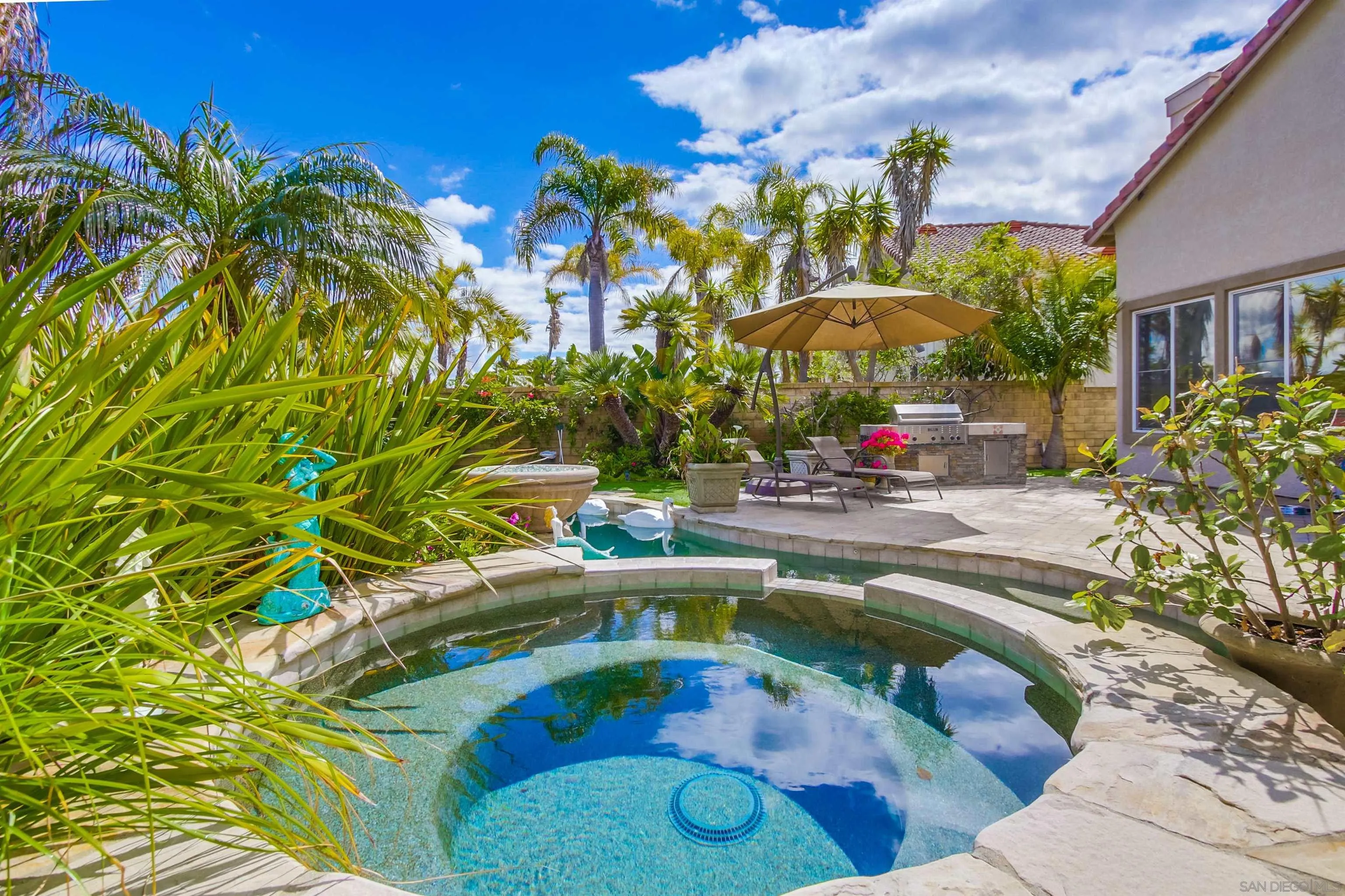 6550 Windward Ridge Way San Diego, CA 92121 - Photo 59 of 64 a swimming pool with outdoor seating and yard