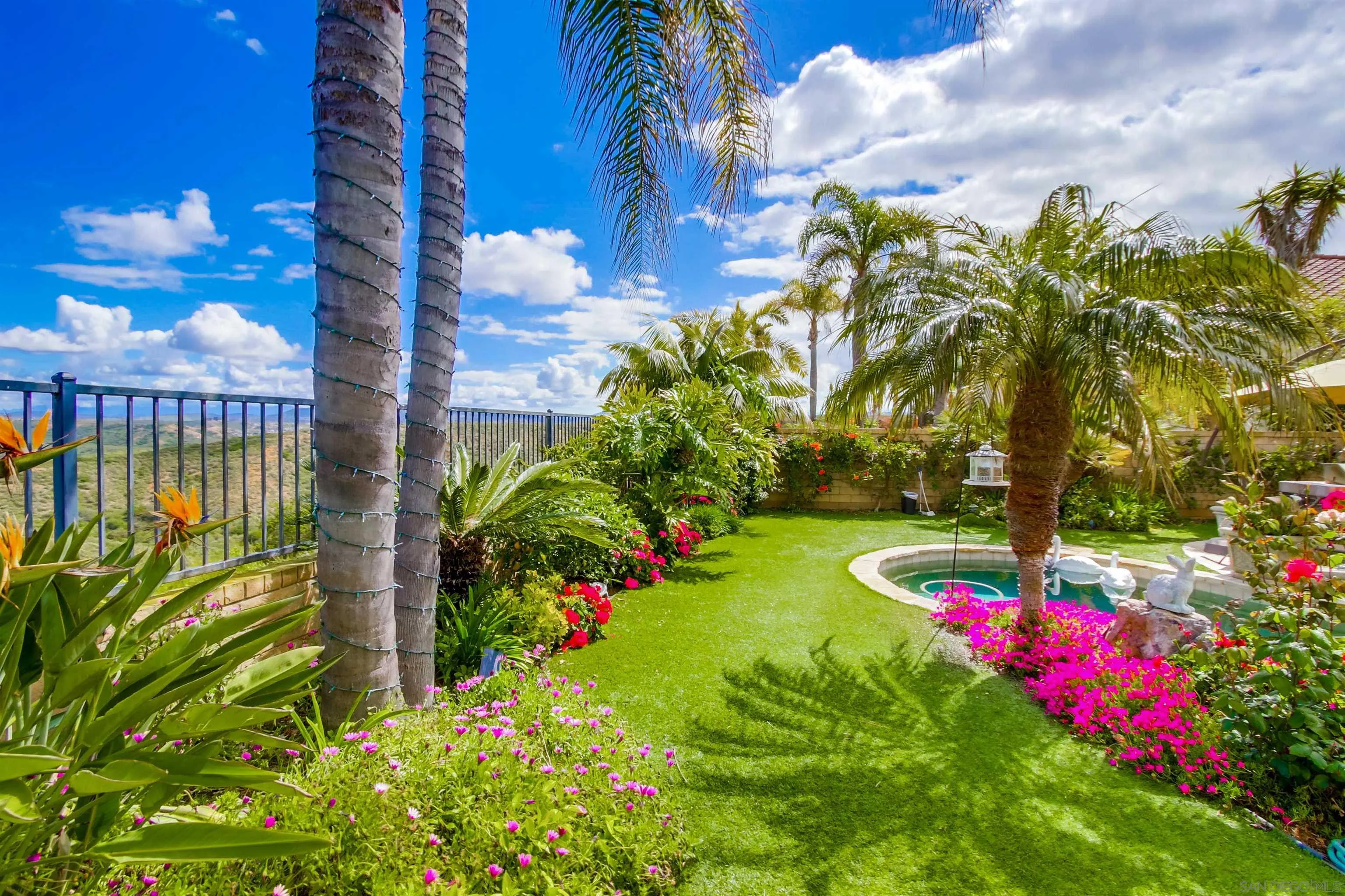 6550 Windward Ridge Way San Diego, CA 92121 - Photo 63 of 64 a view of a flower in front of a house with a big yard