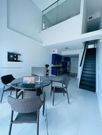 a work room with furniture and wooden floor