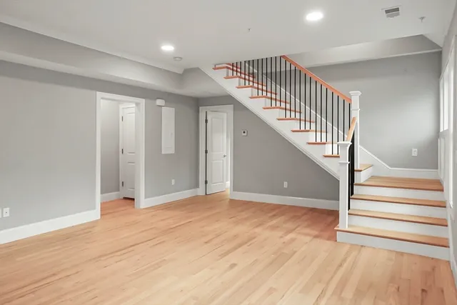 a view of entryway with wooden floor