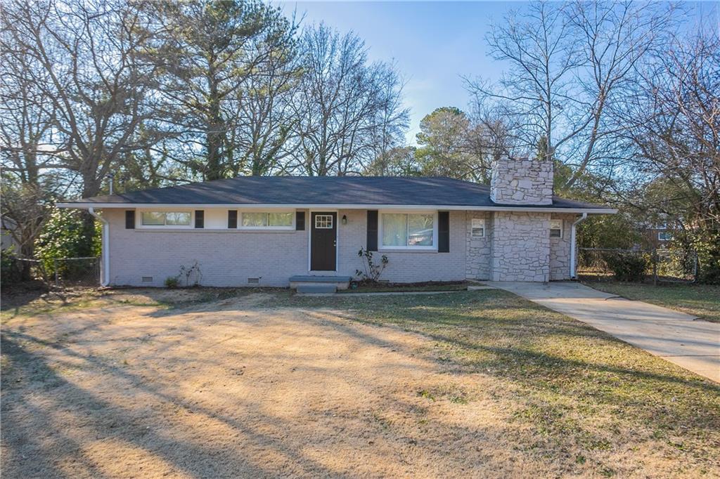 3854 Brookcrest Circle Decatur, GA 30032 - Photo 1 of 1 a view of a house with a yard and large tree