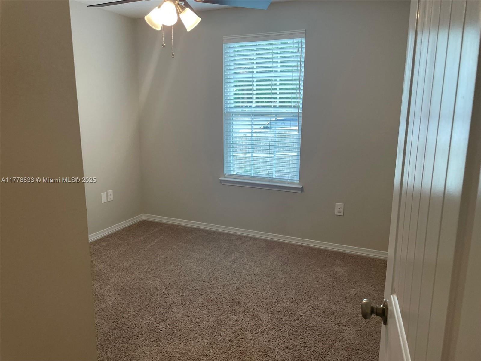 219 Wainwright Drive Crestview, FL 32539 - Photo 24 of 31 an empty room with windows and fan