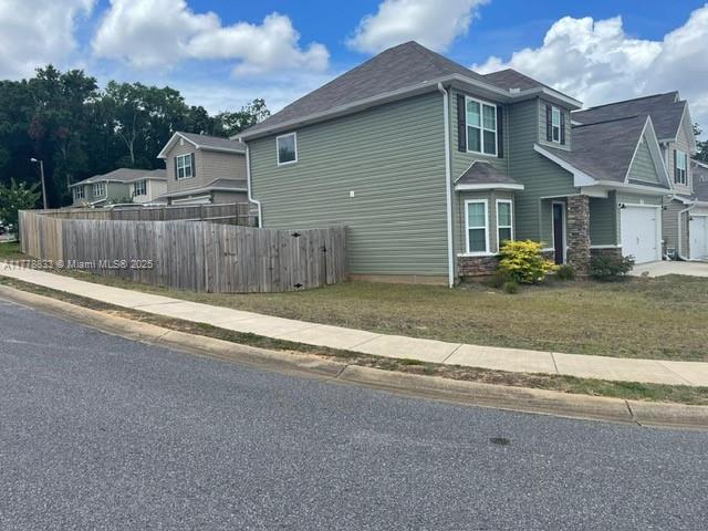 219 Wainwright Drive Crestview, FL 32539 - Photo 26 of 31 a view of a house with a yard and fence