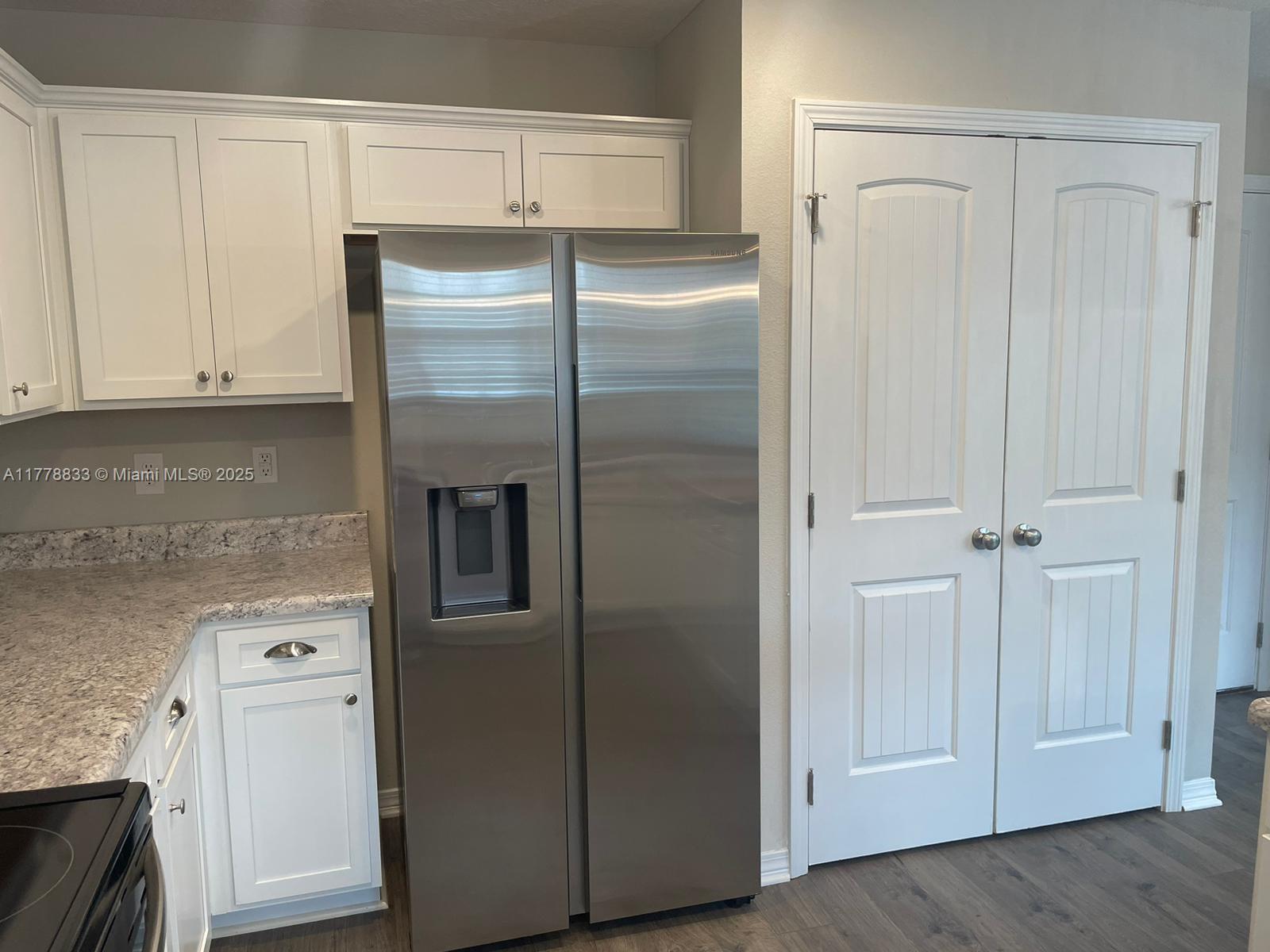219 Wainwright Drive Crestview, FL 32539 - Photo 27 of 31 a view of kitchen with refrigerator and cabinet