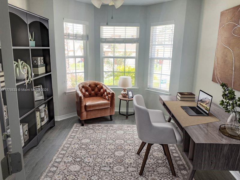 219 Wainwright Drive Crestview, FL 32539 - Photo 4 of 31 a living room with furniture a window and a flat screen tv