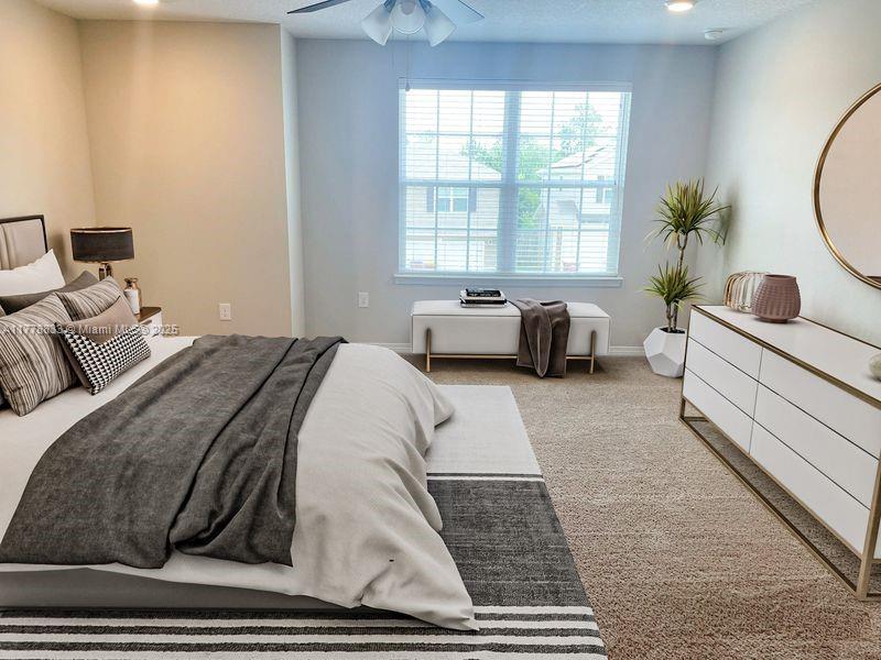 219 Wainwright Drive Crestview, FL 32539 - Photo 6 of 31 a bedroom with a large bed and windows