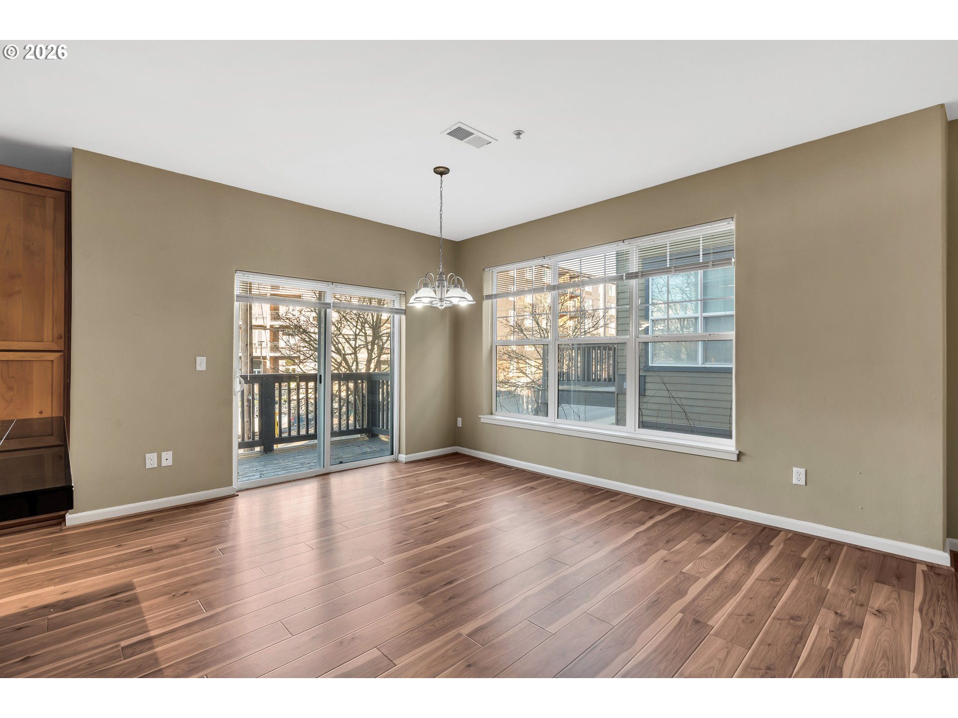 1000 Southwest 170th Avenue, Unit 201 Beaverton, OR 97003 - Photo 12 of 37 a view of an empty room with wooden floor and a window