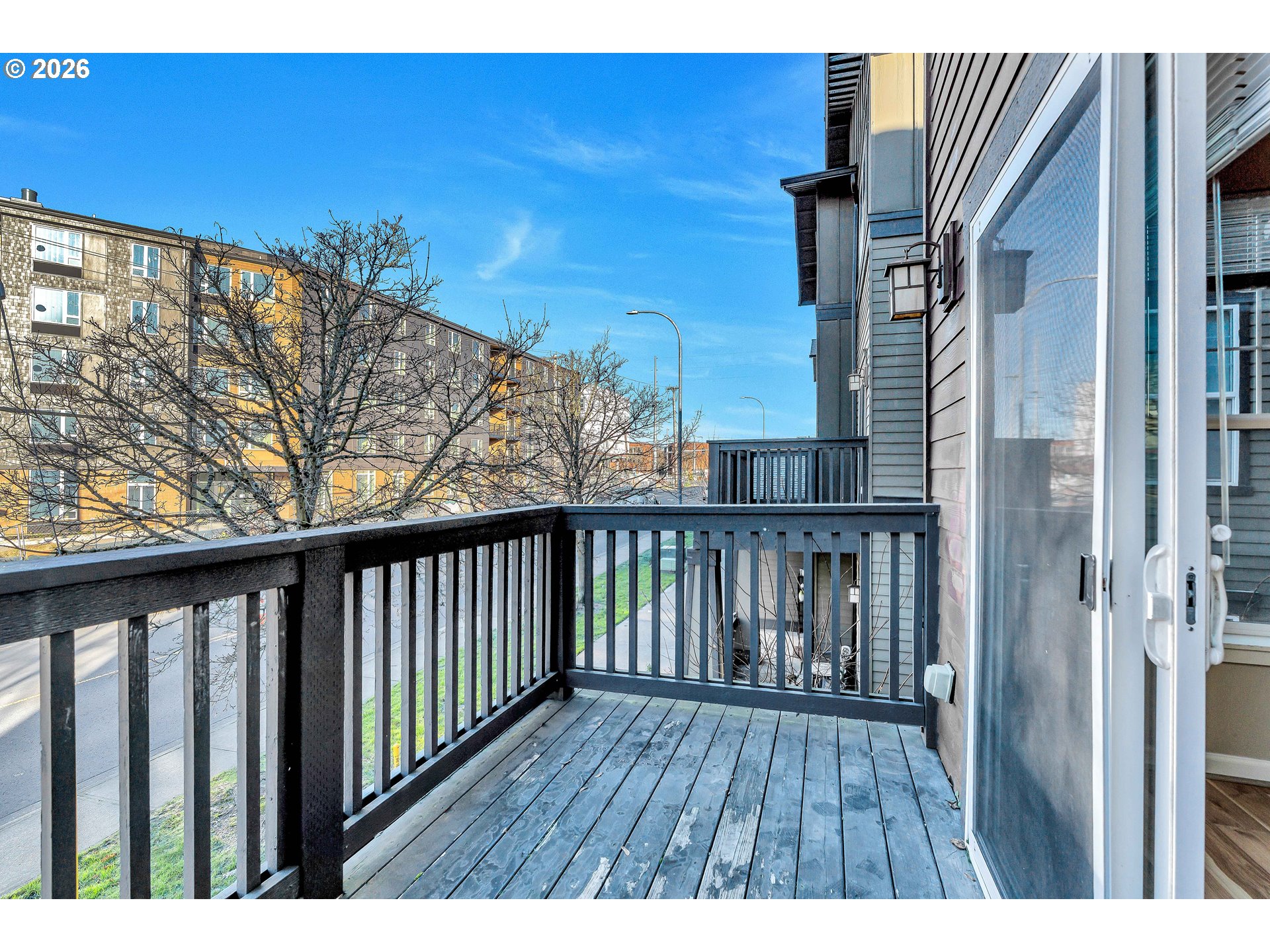 1000 Southwest 170th Avenue, Unit 201 Beaverton, OR 97003 - Photo 15 of 37 a view of balcony with wooden floor and fence