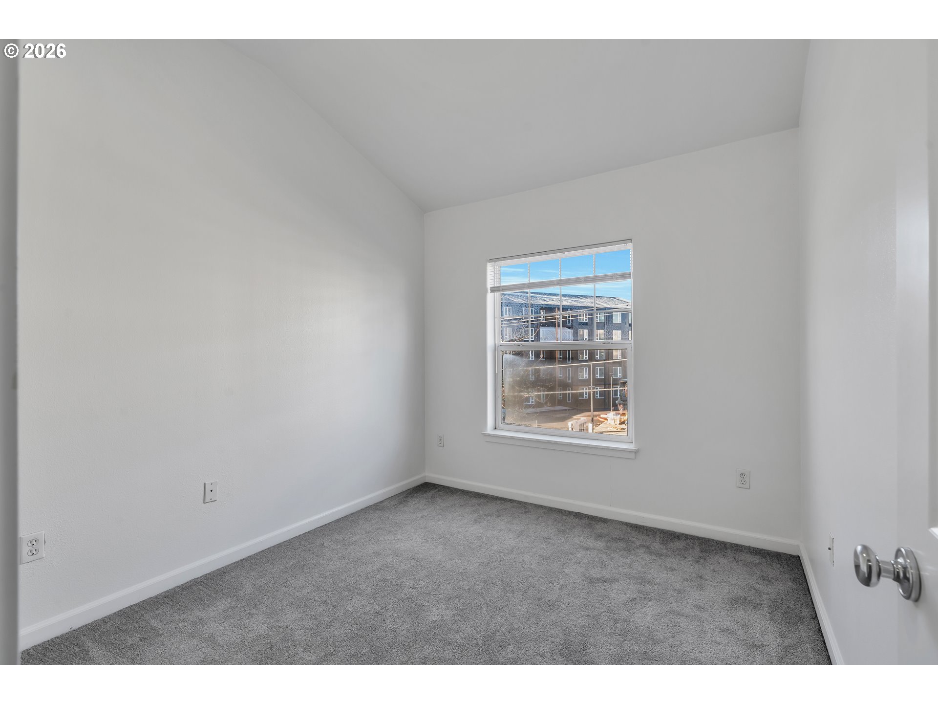 1000 Southwest 170th Avenue, Unit 201 Beaverton, OR 97003 - Photo 18 of 37 a view of an empty room with a window