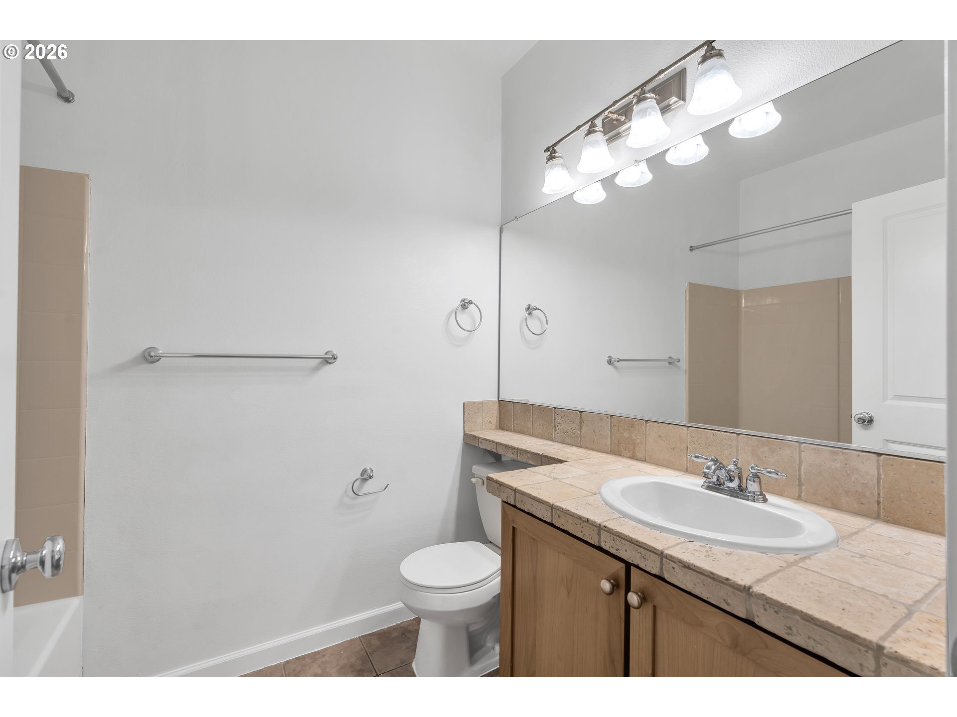 1000 Southwest 170th Avenue, Unit 201 Beaverton, OR 97003 - Photo 22 of 37 a bathroom with a sink a toilet a light fixture and mirror