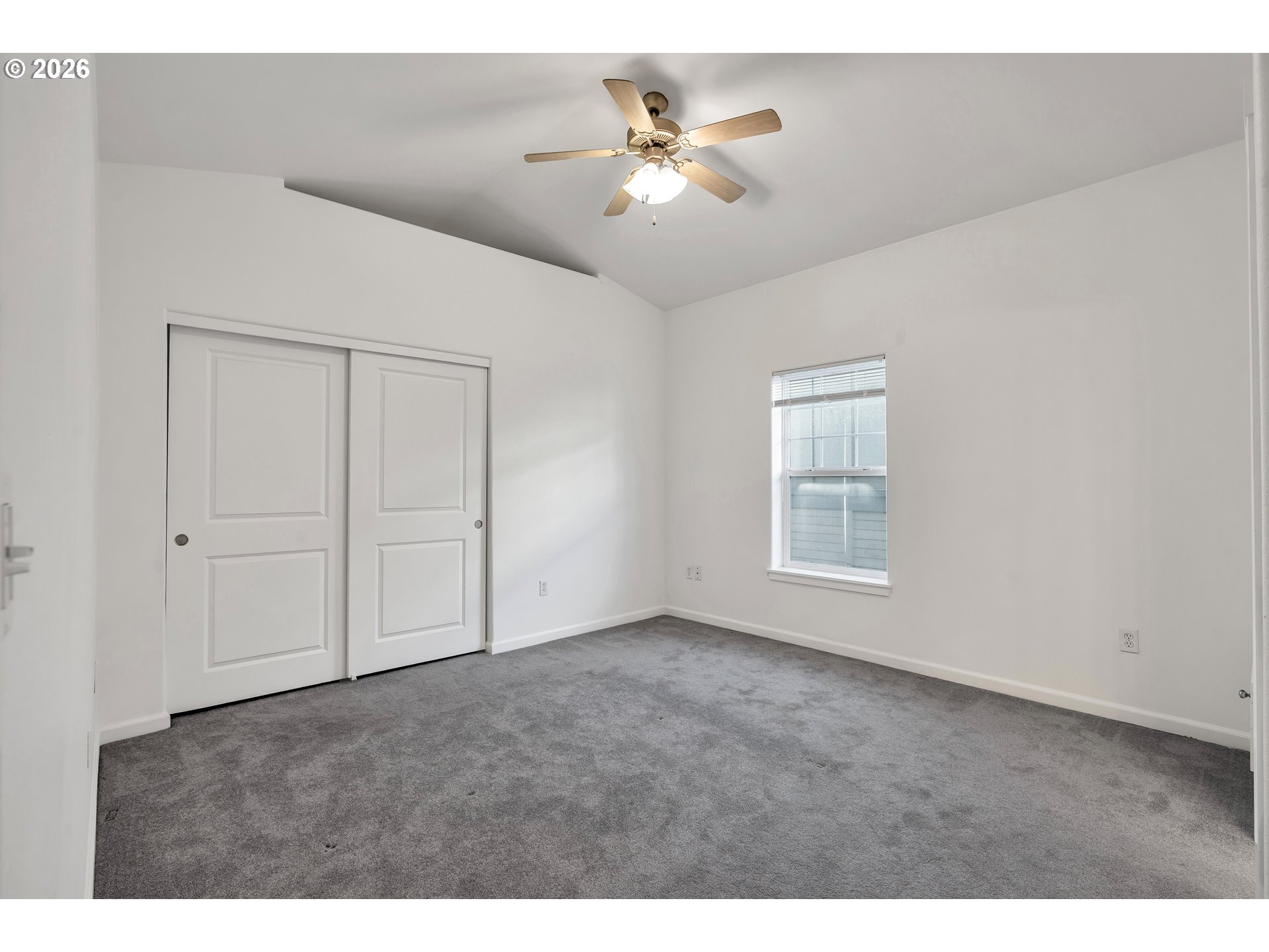 1000 Southwest 170th Avenue, Unit 201 Beaverton, OR 97003 - Photo 23 of 37 a view of an empty room with a ceiling fan
