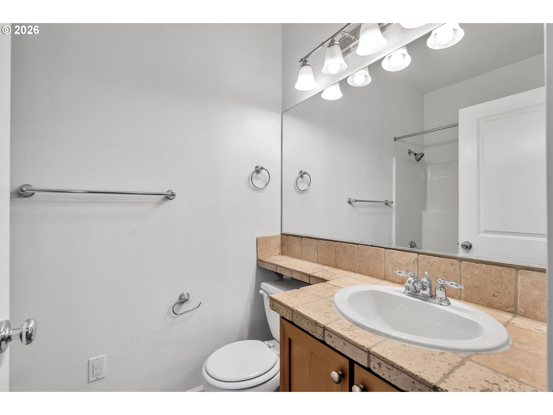 1000 Southwest 170th Avenue, Unit 201 Beaverton, OR 97003 - Photo 27 of 37 a bathroom with a sink vanity mirror and toilet