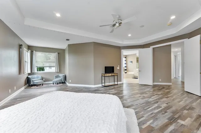 a view of a livingroom with furniture and a flat screen tv