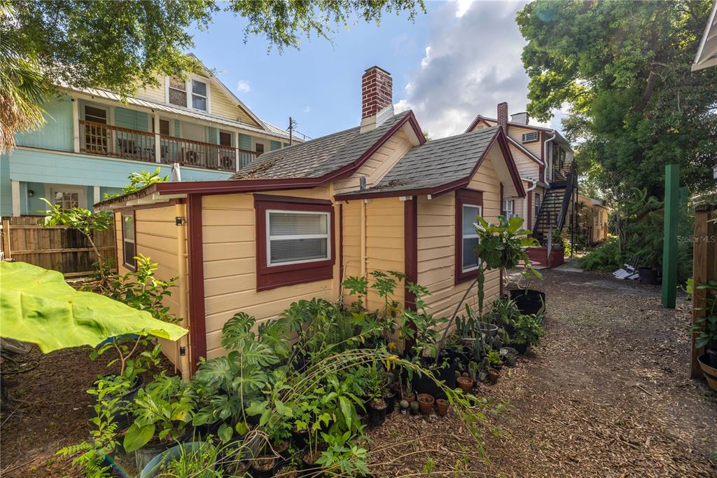 548 3rd Street North St. Petersburg, FL 33701 - Photo 12 of 28 a view of a house with brick walls and a yard