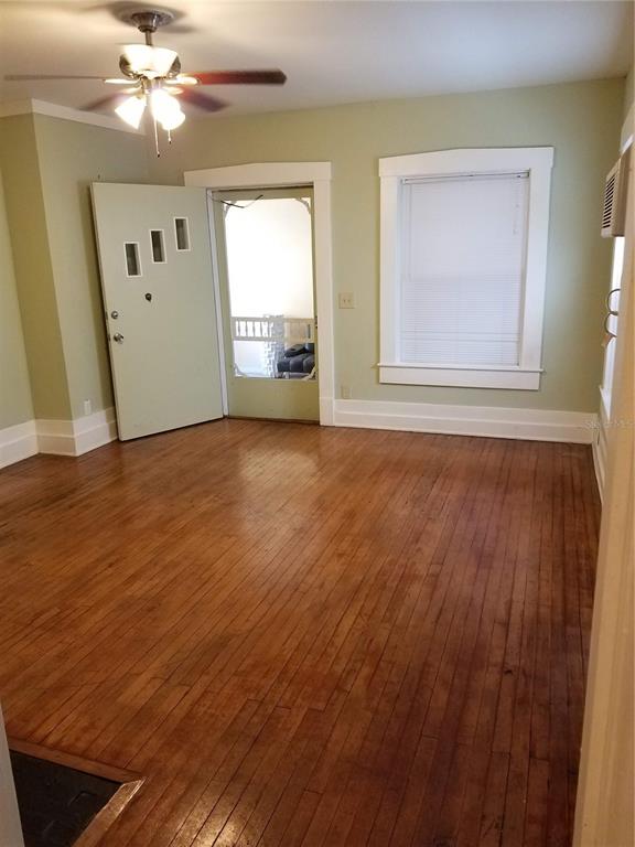 548 3rd Street North St. Petersburg, FL 33701 - Photo 19 of 28 a view of an empty room with window and wooden floor