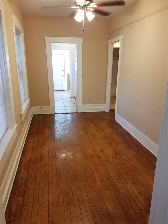 548 3rd Street North St. Petersburg, FL 33701 - Photo 22 of 28 a view of an empty room with wooden floor and a window