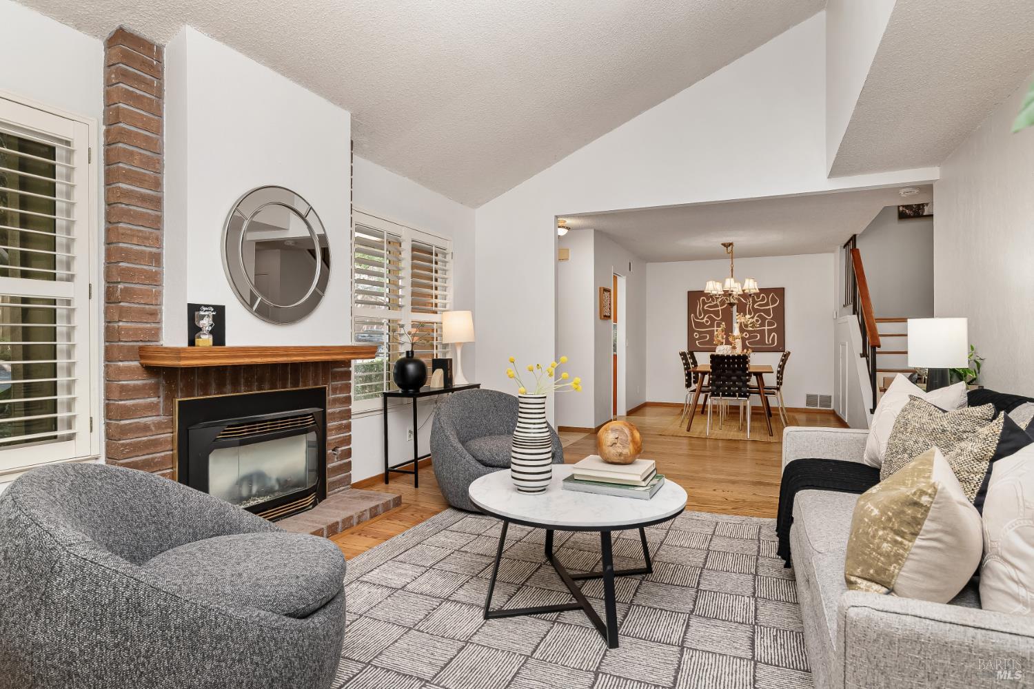 4 California Condor Way Novato, CA 94949 - Photo 5 of 20 a living room with furniture a fireplace a rug and a window