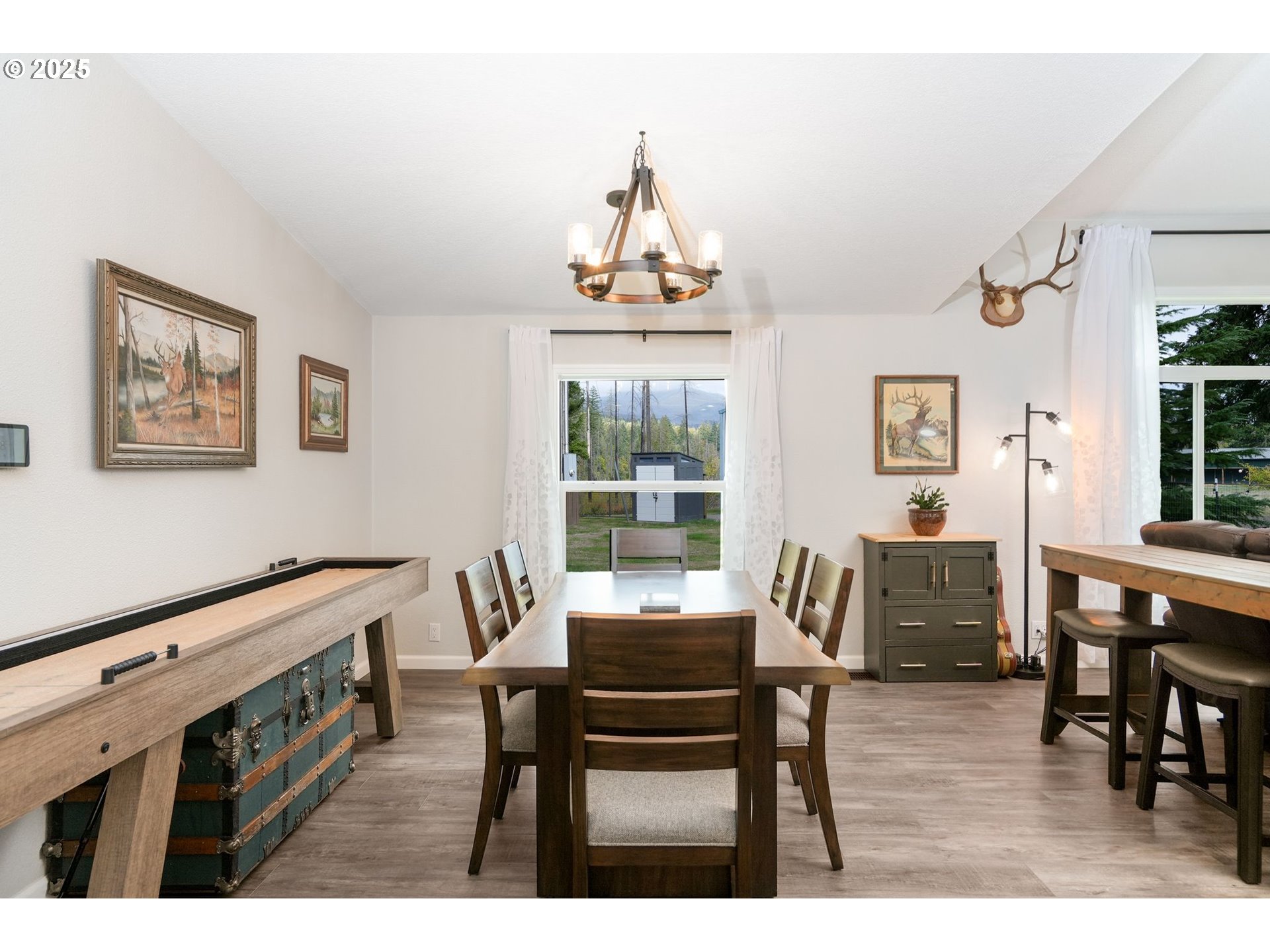40219 North Dogwood Road Mill City, OR 97360 - Photo 17 of 47 a view of a dining room with furniture window and wooden floor