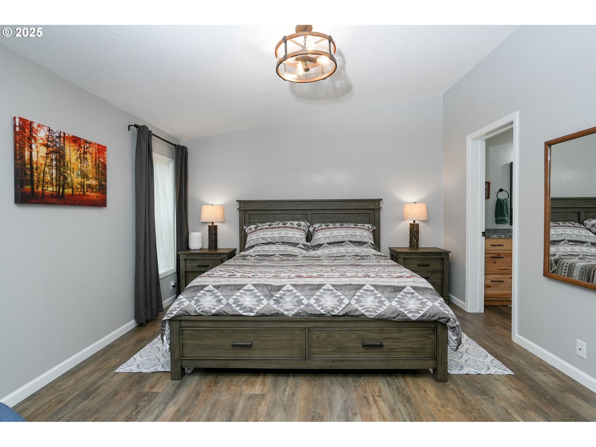 40219 North Dogwood Road Mill City, OR 97360 - Photo 19 of 47 a bed sitting in a bedroom next to a window